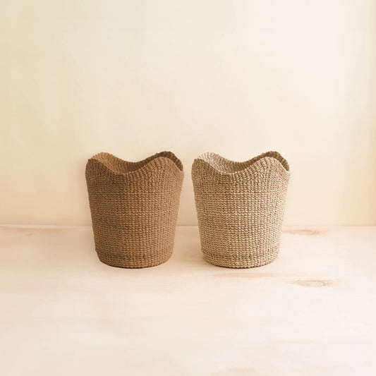 Small natural abaca woven scallop basket for coastal slow living spaces
