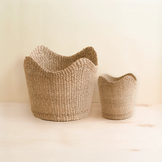 Small natural abaca woven scallop basket for coastal slow living spaces
